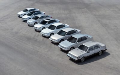 Several silver sedans parked in a row.