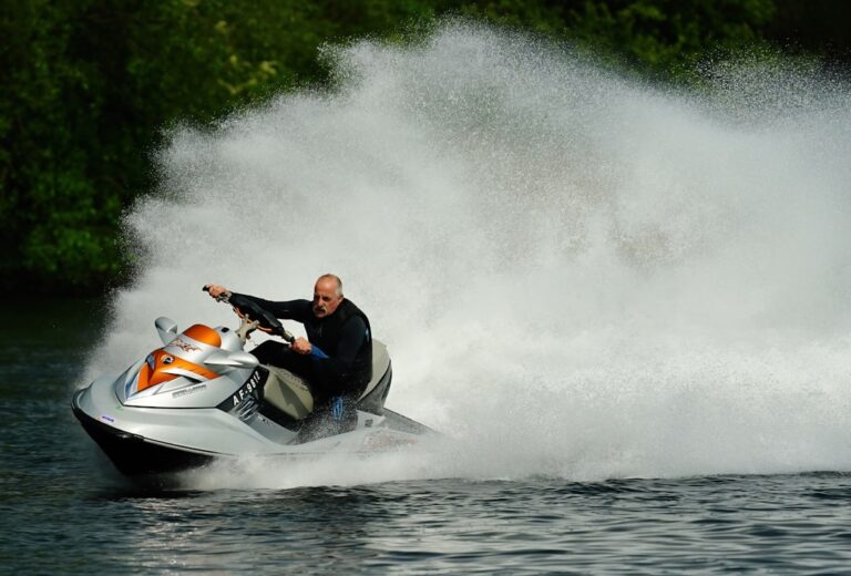 a man riding a jet ski