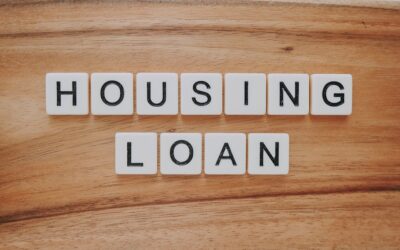 housing loan blocks on brown wooden surface