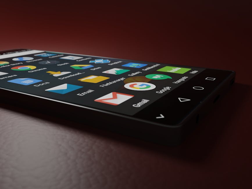 Close-up of a smartphone displaying various app icons in a low-light setting.