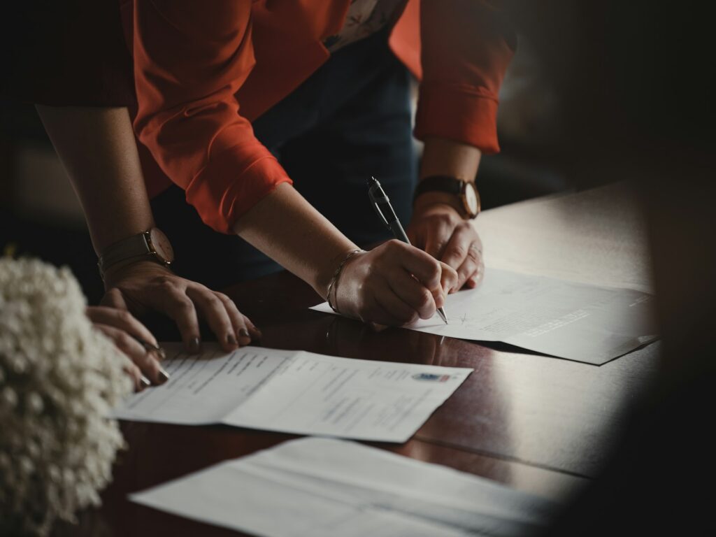 Borrower signing a loan agreement