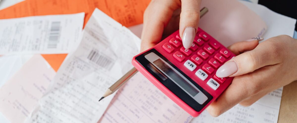 Calculator on top of household bills