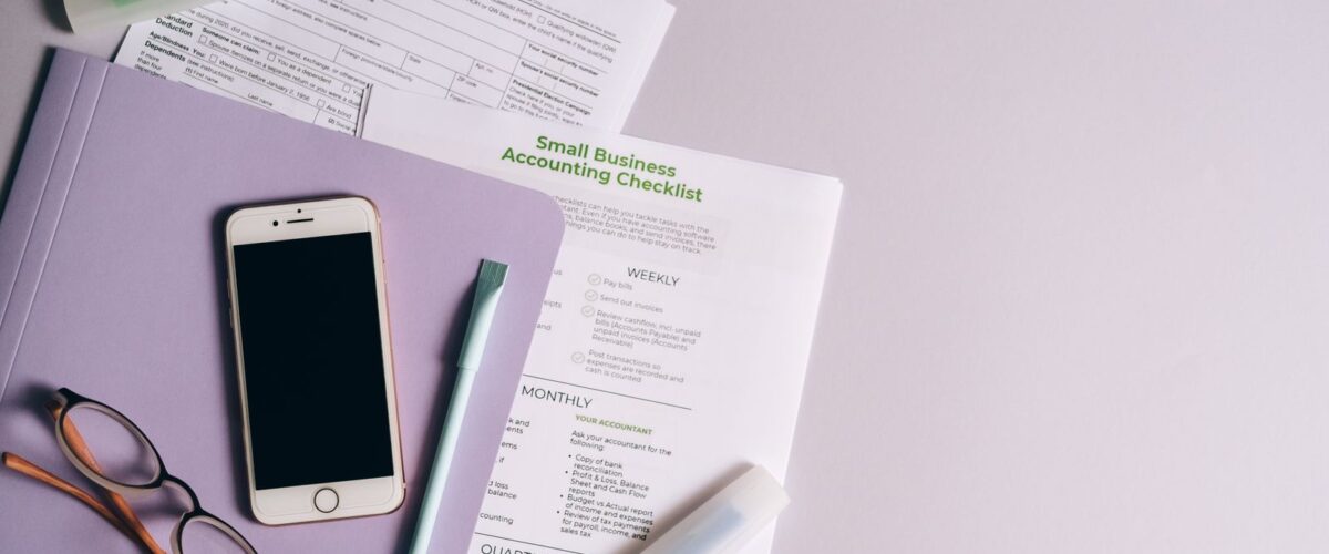 Documents and a checklist on a desk